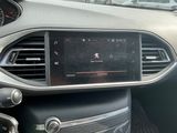 the dashboard of a car with a digital display in the center of it
