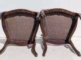 pair of antique chairs with upholstered back and arms