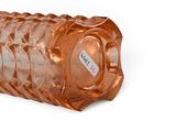 a plastic bottle with a label on it on a white surface