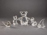 a group of glass figurines of animals and birds