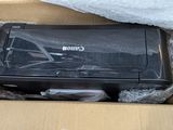 a canon printer sitting in a cardboard box on the floor
