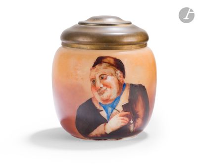 a small jar with a picture of a man on it