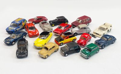 a lot of small toy cars on a white surface