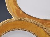 two plates that are sitting on top of each other