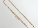 a gold chain with a clasp on a white background