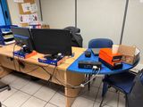 an image of a desk with two monitors and a keyboard
