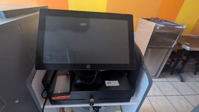 a small monitor sitting on top of a desk