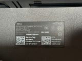 a label on the back of a laptop that says dell