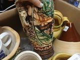 a box full of different types of vases in a store