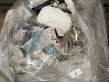 a plastic bag full of items sitting on the floor