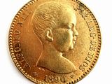 une image représentant une pièce d'or sur laquelle figure le portrait d'un enfant