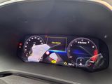 an image of a car dashboard with a digital gauge