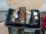 two bins filled with assorted metal items on a cart
