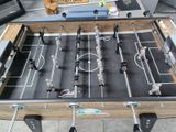 a foosball table with a dog on it
