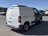 a white van that is parked in a parking lot