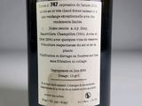 a label on a bottle of wine on a table