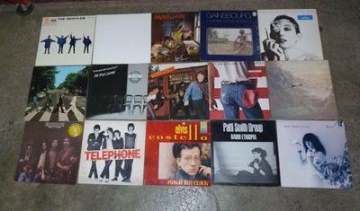 a lot of records on the floor of this room