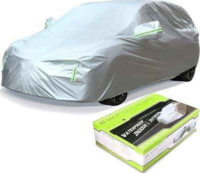 the car is covered with a silver cover and a box of tissues