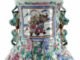 a vase with a picture of a man and a dog on it
