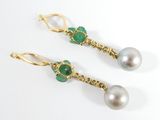 a pair of emerald and pearl earrings