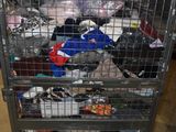 a metal cart with many items in it in a room