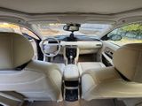 the interior of a car with two leather seats and a steering wheel