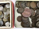two boxes full of coins sitting next to each other
