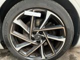 a close up of a car tire with a sticker on it