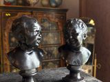 pair of antique bronze busts of a boy and a girl