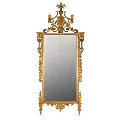 une image représentant un miroir à cadre doré sur lequel est représenté un oiseau