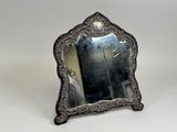 a mirror that is sitting on a table