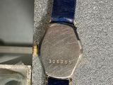 a watch that is sitting on top of a piece of paper
