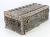 an old suitcase sitting on top of a white surface