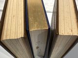 two books that are sitting on a white table