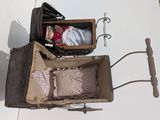 a doll in a box with a doll inside of it