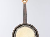 a banjo hanging from a string with a guitar in the background
