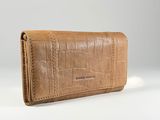 an image of a women ' s leather wallet on a white background