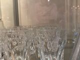 a lot of glasses sitting on a glass table