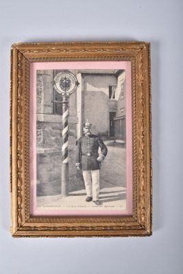 an old picture of a man in a military uniform standing in front of a clock
