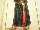 an open book with a drawing of a woman in a black dress