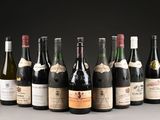 several bottles of wine are lined up in a row on a table