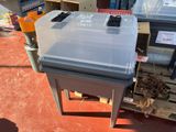 a small table with a remote control on top of it