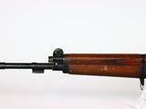 a close up of a rifle on a white surface with a white background
