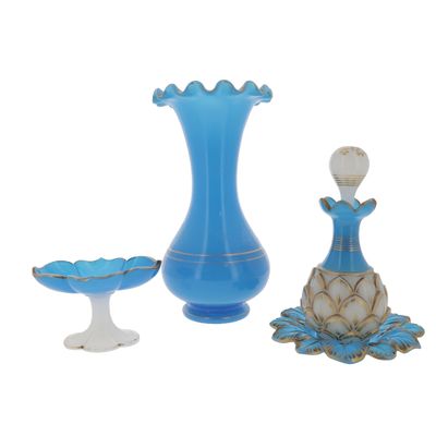 a blue vase and a bowl sitting next to each other