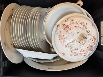a stack of plates and bowls in a black box