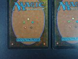two decks of magic the gathering deck cards on a table