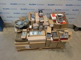 many boxes of assorted electronics on a pallet