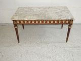 a marble top coffee table with a wooden base