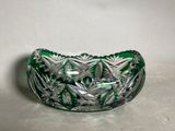 an image of a green glass bowl sitting on top of a table