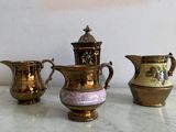three vases sitting next to each other on a table